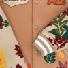 KidSuper Studios X Starbucks Team Pumpkin Spice Latte (PSL) Varsity Jacket Close Up Image
